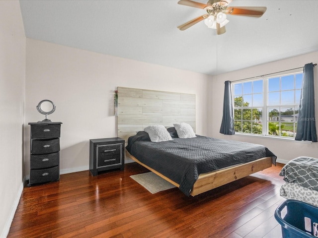 437 Bridgewater Ct, Kissimmee, FL 34758 - bedroom with hardwood / wood-style floors, baseboards, and a ceiling fan