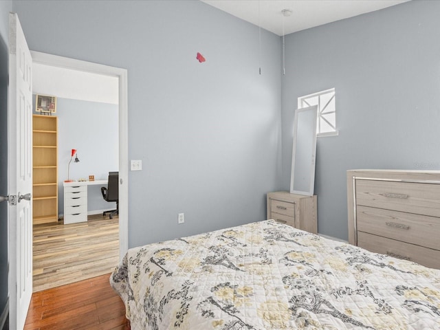 437 Bridgewater Ct, Kissimmee, FL 34758 - bedroom with wood finished floors and an office area