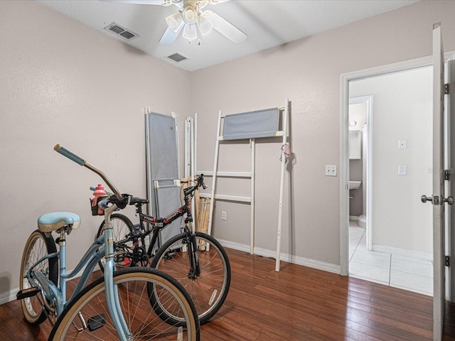 437 Bridgewater Ct, Kissimmee, FL 34758 - exercise room featuring a ceiling fan, hardwood / wood-style flooring, and baseboards