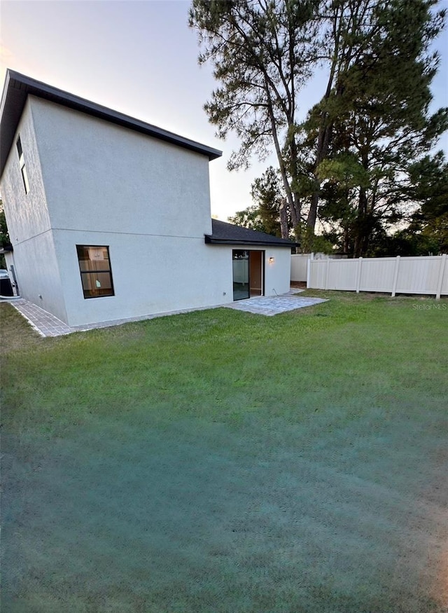 107 Grove St, Orlando, FL 32835 - back of property with a patio area and stucco siding