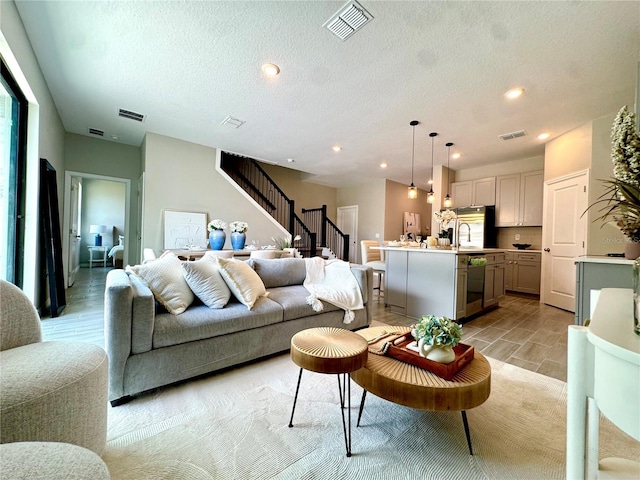 107 Grove St, Orlando, FL 32835 - living area with stairway, recessed lighting, and a textured ceiling