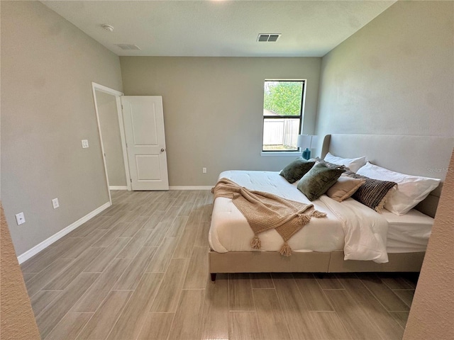 107 Grove St, Orlando, FL 32835 - bedroom featuring light wood-type flooring and baseboards