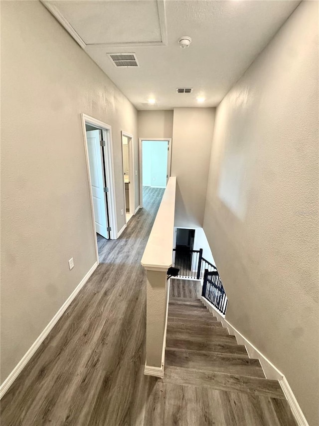 107 Grove St, Orlando, FL 32835 - stairs with wood finished floors and baseboards