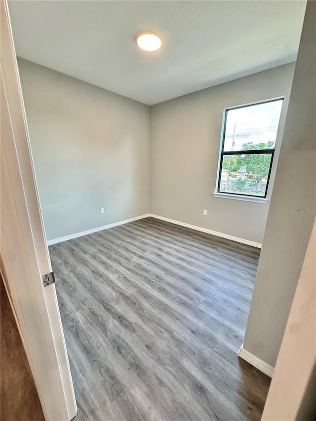 107 Grove St, Orlando, FL 32835 - spare room with wood finished floors and baseboards