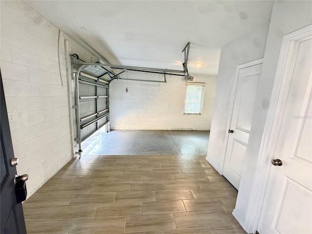 107 Grove St, Orlando, FL 32835 - garage featuring a garage door opener and concrete block wall