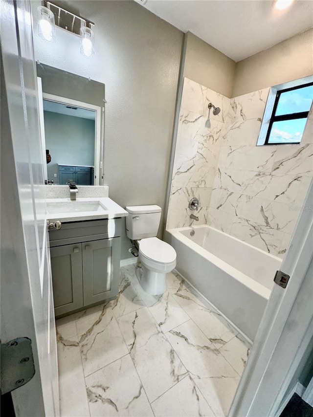 107 Grove St, Orlando, FL 32835 - bathroom featuring vanity, toilet, tub / shower combination, marble finish floors, and baseboards