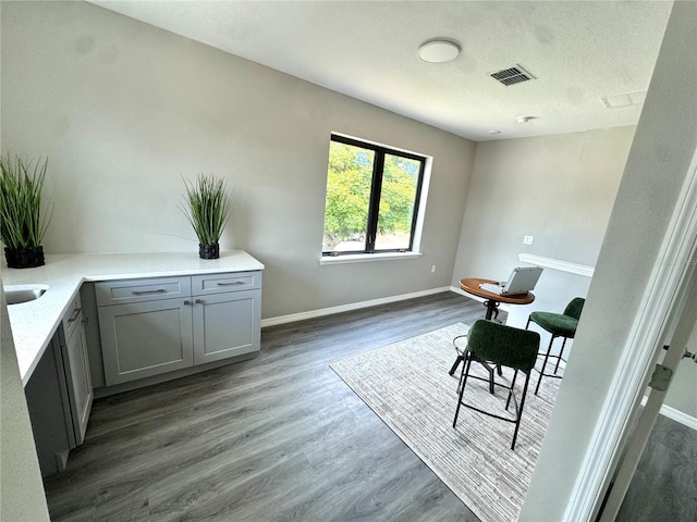 107 Grove St, Orlando, FL 32835 - office area featuring dark wood-style floors, baseboards, and a textured ceiling