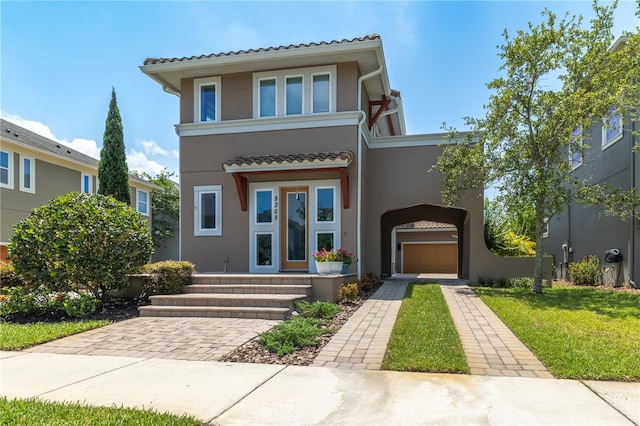 8268 Bellow St, Orlando, FL 32827 - view of front of house featuring stucco siding, a tile roof, a front lawn, and a garage