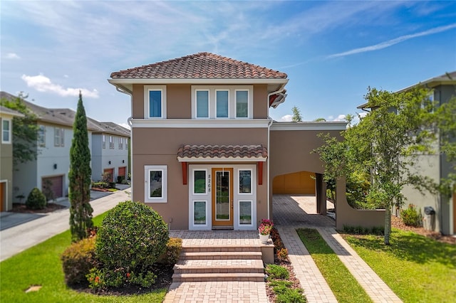 8268 Bellow St, Orlando, FL 32827 - multi unit property featuring a tile roof, stucco siding, and driveway
