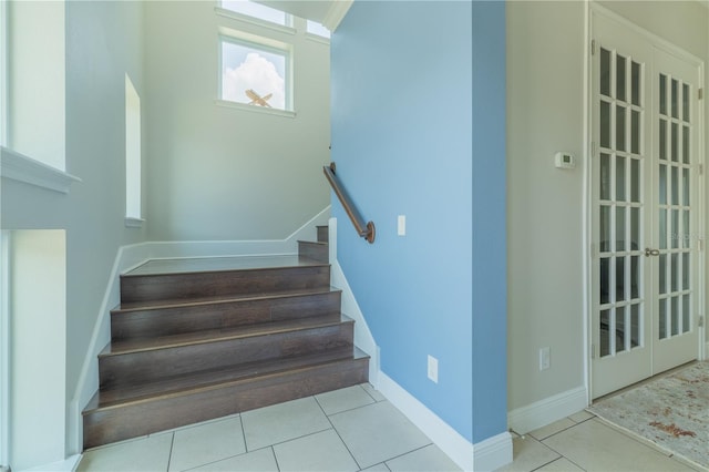 8268 Bellow St, Orlando, FL 32827 - stairway featuring tile patterned floors and baseboards