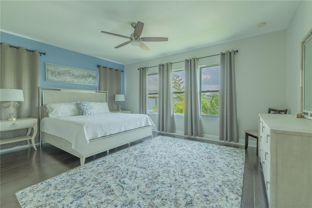 8268 Bellow St, Orlando, FL 32827 - bedroom with wood finished floors, baseboards, and a ceiling fan