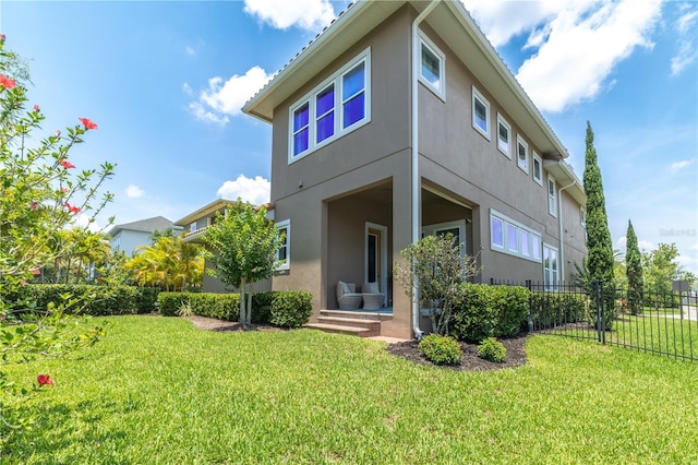 8268 Bellow St, Orlando, FL 32827 - rear view of house featuring stucco siding