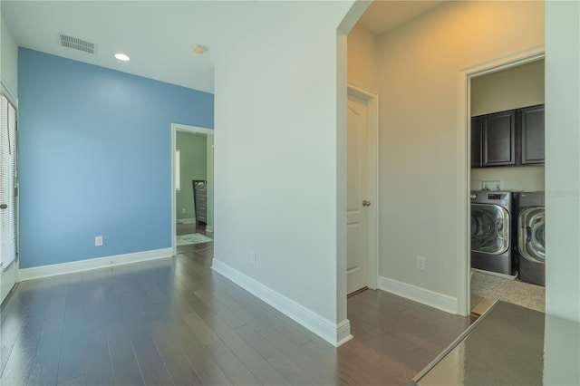 8268 Bellow St, Orlando, FL 32827 - corridor featuring separate washer and dryer, dark wood-type flooring, baseboards, and recessed lighting