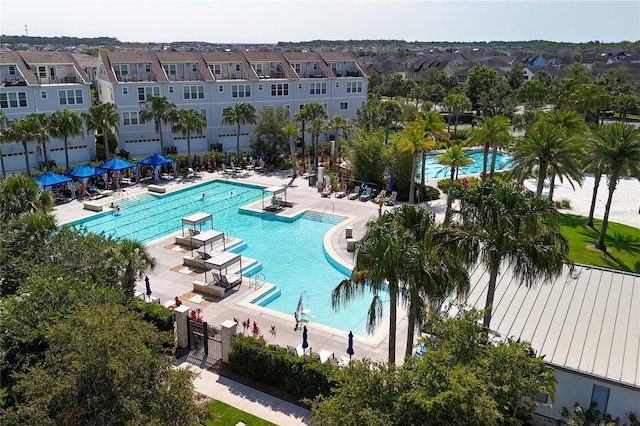 8268 Bellow St, Orlando, FL 32827 - community pool featuring a residential view