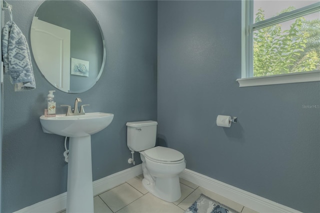 8268 Bellow St, Orlando, FL 32827 - half bath featuring toilet, tile patterned flooring, and baseboards
