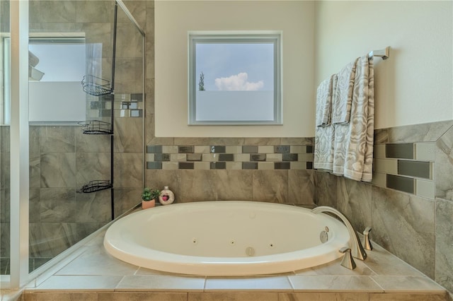 8268 Bellow St, Orlando, FL 32827 - bathroom with a tub with jets and a tile shower