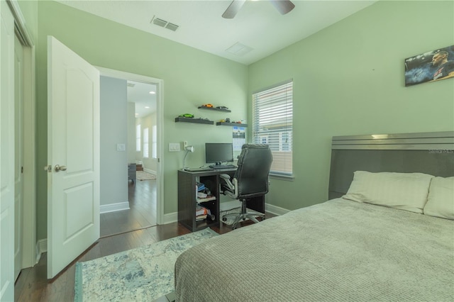 8268 Bellow St, Orlando, FL 32827 - bedroom featuring wood finished floors, a desk, baseboards, and ceiling fan