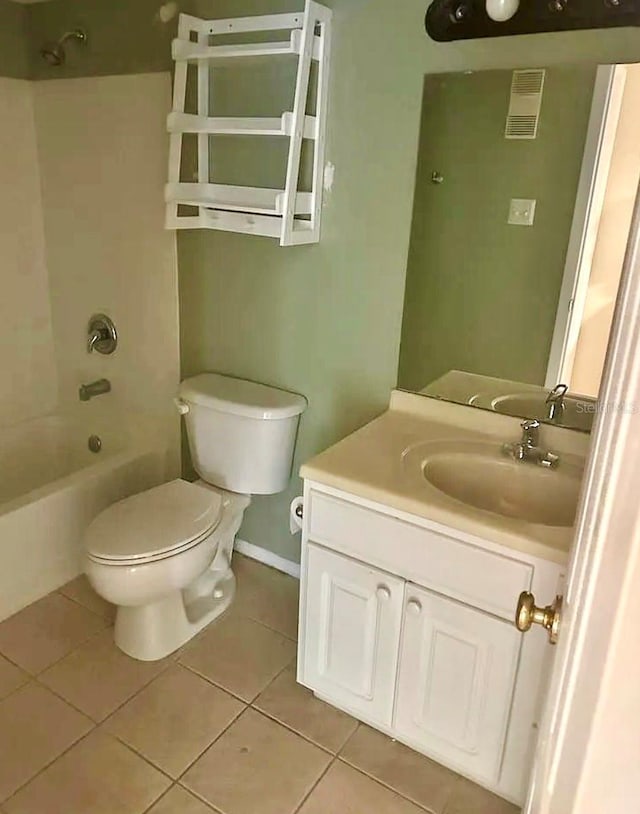 3772 Idlebrook Cir Unit 100, Casselberry, FL 32707 - bathroom with toilet, vanity, tile patterned flooring, shower / tub combination, and baseboards