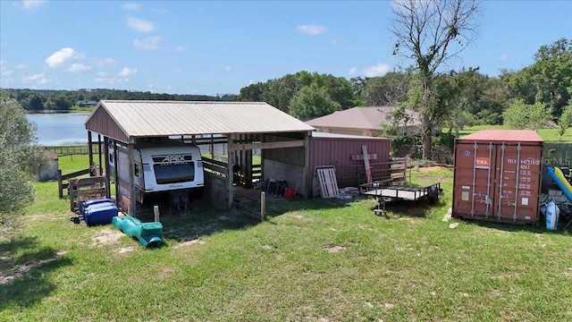 16386 SE 156th Place Rd, Weirsdale, FL 32195 - view of grassy yard featuring a carport and a water view