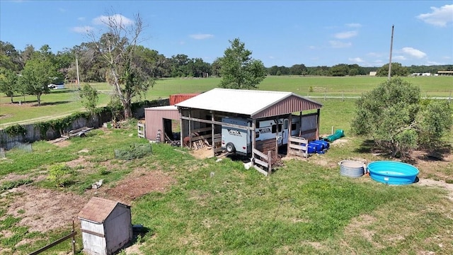 16386 SE 156th Place Rd, Weirsdale, FL 32195 - view of pole building featuring a view of rural / pastoral area and a yard
