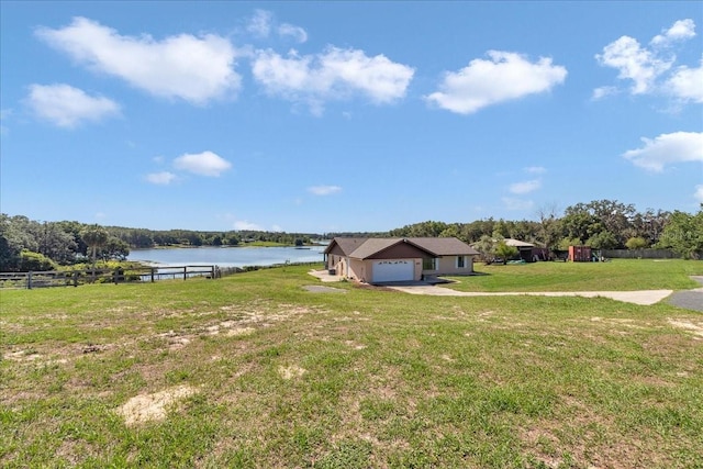 16386 SE 156th Place Rd, Weirsdale, FL 32195 - view of yard with a water view, an attached garage, and a playground