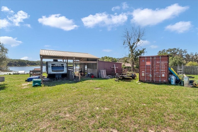 16386 SE 156th Place Rd, Weirsdale, FL 32195 - view of green lawn with a detached carport and a water view
