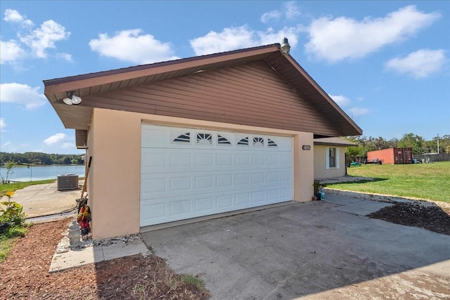 16386 SE 156th Place Rd, Weirsdale, FL 32195 - garage featuring a water view and central air condition unit