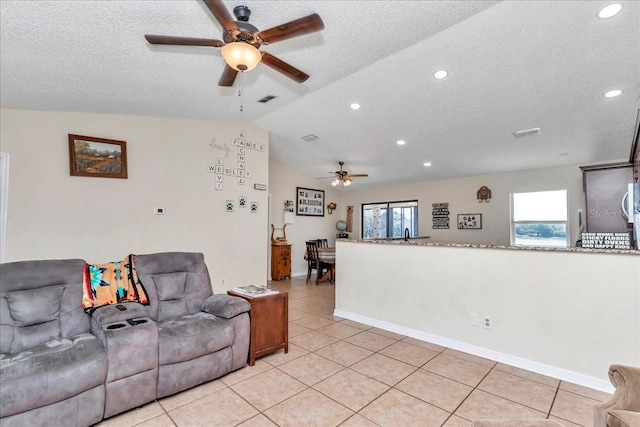 16386 SE 156th Place Rd, Weirsdale, FL 32195 - living room featuring ceiling fan, light tile patterned floors, a textured ceiling, lofted ceiling, and recessed lighting