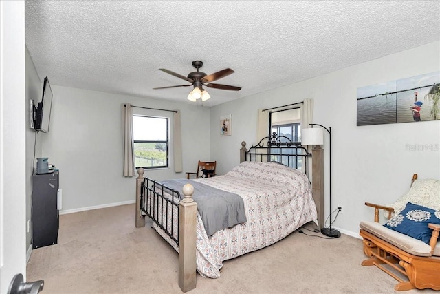 16386 SE 156th Place Rd, Weirsdale, FL 32195 - bedroom with carpet, baseboards, ceiling fan, and a textured ceiling