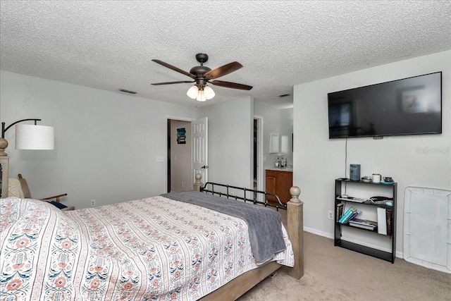 16386 SE 156th Place Rd, Weirsdale, FL 32195 - bedroom with light carpet, a ceiling fan, a textured ceiling, and baseboards