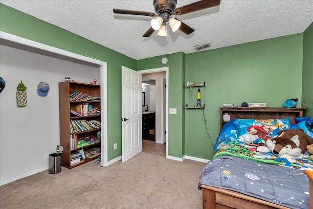 16386 SE 156th Place Rd, Weirsdale, FL 32195 - bedroom featuring carpet flooring, a textured ceiling, baseboards, and ceiling fan