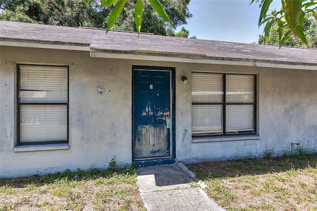 15372 George Blvd, Clearwater, FL 33760 - view of exterior entry featuring stucco siding