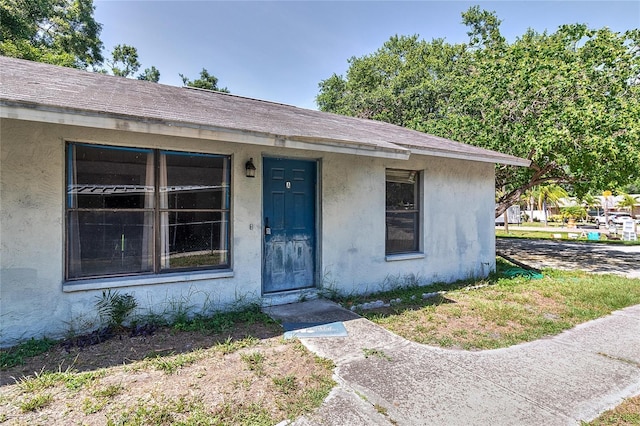 15372 George Blvd, Clearwater, FL 33760 - property entrance with stucco siding