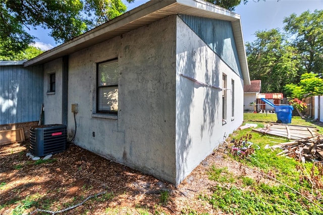 15372 George Blvd, Clearwater, FL 33760 - view of property exterior featuring central air condition unit