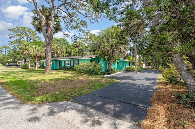 445 Pine Blvd, Merritt Island, FL 32952 - view of front of home with a front yard and asphalt driveway