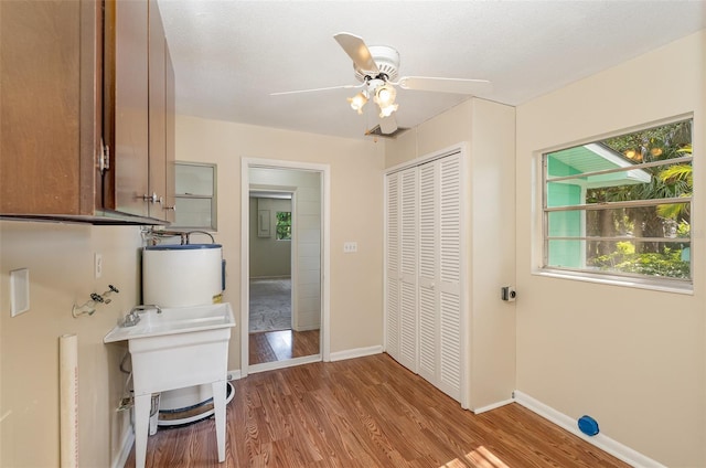 445 Pine Blvd, Merritt Island, FL 32952 - bathroom featuring wood finished floors, ceiling fan, and baseboards