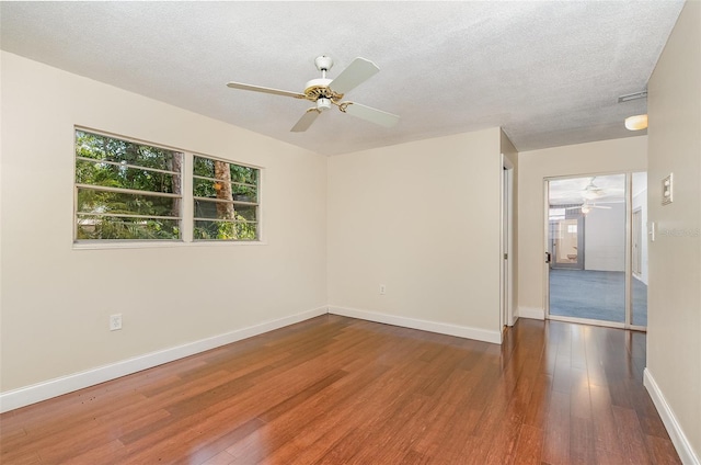 445 Pine Blvd, Merritt Island, FL 32952 - empty room with ceiling fan, wood finished floors, baseboards, and a textured ceiling