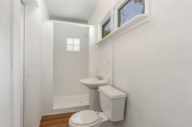 445 Pine Blvd, Merritt Island, FL 32952 - bathroom featuring a shower stall, toilet, and wood finished floors
