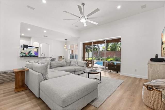 356 Via Tuscany Loop, Lake Mary, FL 32746 - living area with arched walkways, a ceiling fan, light wood-style flooring, recessed lighting, and baseboards
