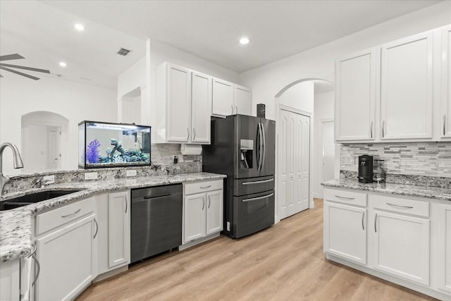 356 Via Tuscany Loop, Lake Mary, FL 32746 - kitchen with stainless steel appliances, a sink, backsplash, white cabinets, and recessed lighting