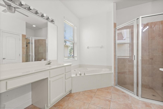 356 Via Tuscany Loop, Lake Mary, FL 32746 - bathroom with vanity, a garden tub, a shower stall, and tile patterned floors