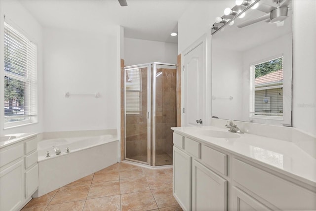 356 Via Tuscany Loop, Lake Mary, FL 32746 - full bath featuring vanity, a stall shower, a garden tub, and tile patterned floors