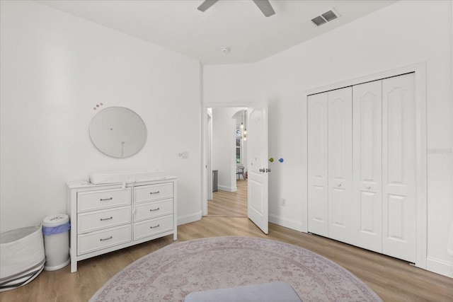 356 Via Tuscany Loop, Lake Mary, FL 32746 - bedroom with light wood-type flooring, a closet, ceiling fan, and baseboards