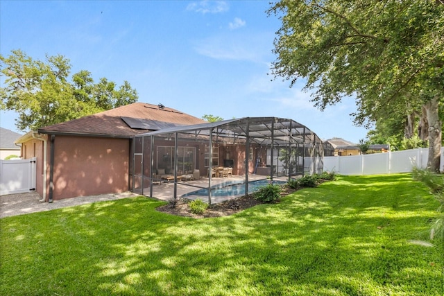 356 Via Tuscany Loop, Lake Mary, FL 32746 - rear view of house featuring roof mounted solar panels, a patio area, and glass enclosure