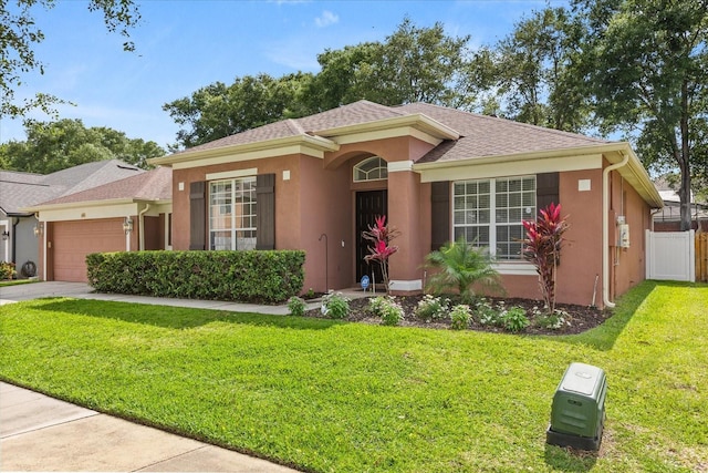 356 Via Tuscany Loop, Lake Mary, FL 32746 - ranch-style home featuring an attached garage, stucco siding, driveway, and roof with shingles
