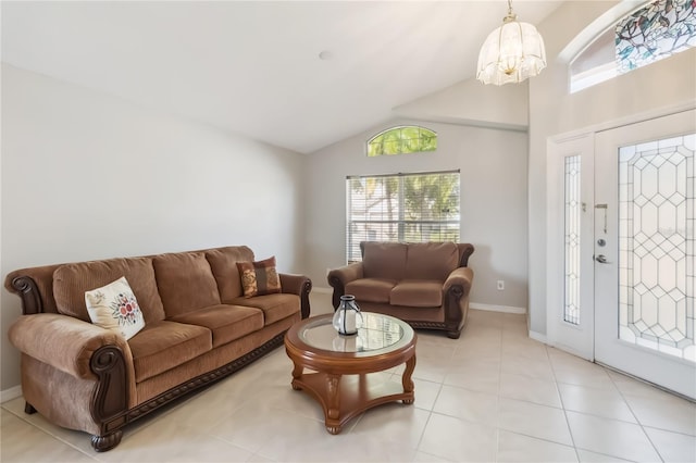 2481 Deer Creek Blvd, Saint Cloud, FL 34772 - living area with a chandelier, lofted ceiling, light tile patterned flooring, and baseboards