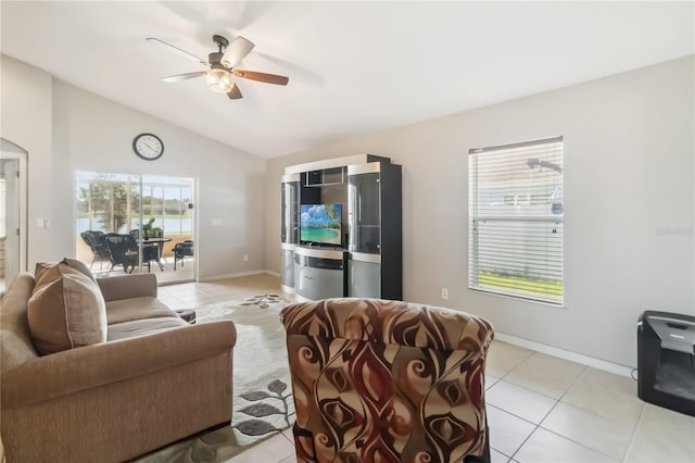 2481 Deer Creek Blvd, Saint Cloud, FL 34772 - living area with light tile patterned floors, lofted ceiling, ceiling fan, baseboards, and arched walkways