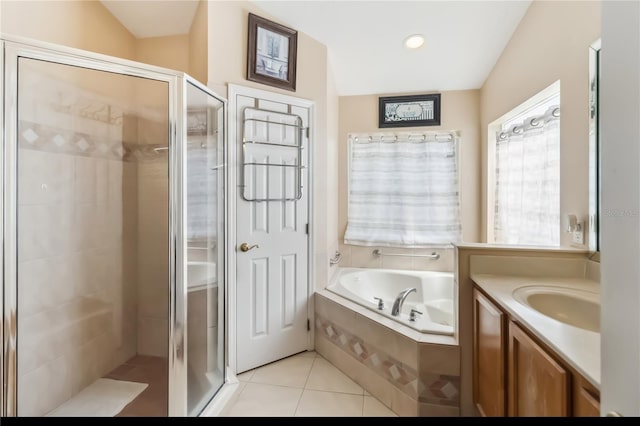 2481 Deer Creek Blvd, Saint Cloud, FL 34772 - full bathroom featuring a stall shower, a garden tub, vanity, and tile patterned floors