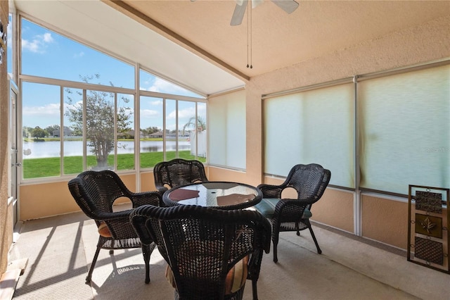 2481 Deer Creek Blvd, Saint Cloud, FL 34772 - sunroom with vaulted ceiling, a water view, carpet flooring, ceiling fan, and outdoor dining space