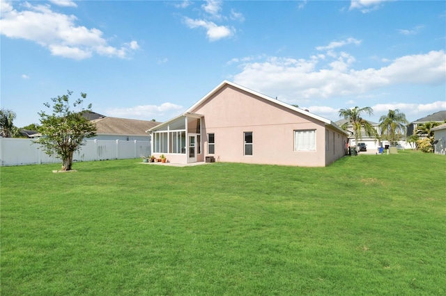 2481 Deer Creek Blvd, Saint Cloud, FL 34772 - rear view of property featuring a sunroom and stucco siding